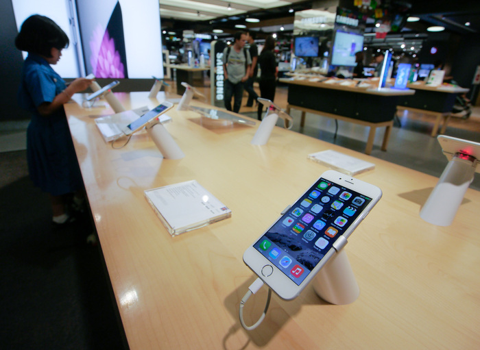 Samsung showroom in Bangkok touts the latest in the country's line of smartphones. As of 2013, there are 92.46 million mobile phone subscribers in Thailand - a number that amounts 136% of the population. ADB Flickr