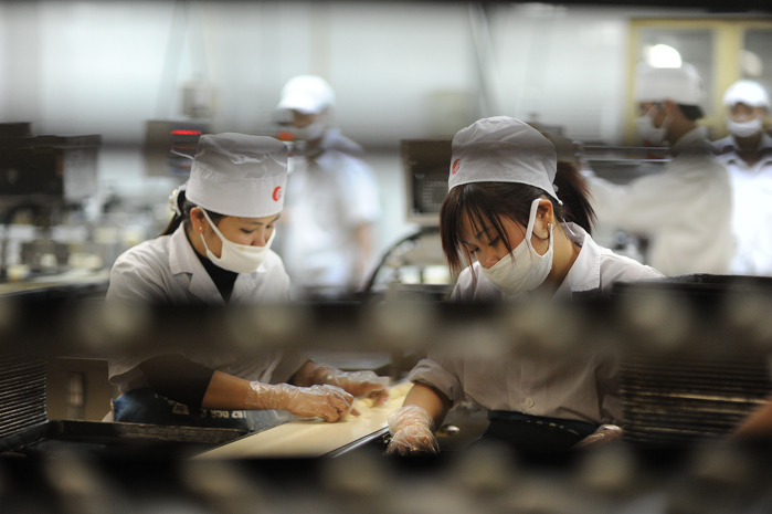 Technicians from the government performing their tasks in response to the strengthened food safety surveillance, handling, and inspection programs. ADB Flickr