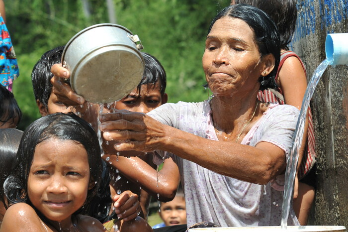 People enjoying the benefits of the water treatment facility. ADB Flickr